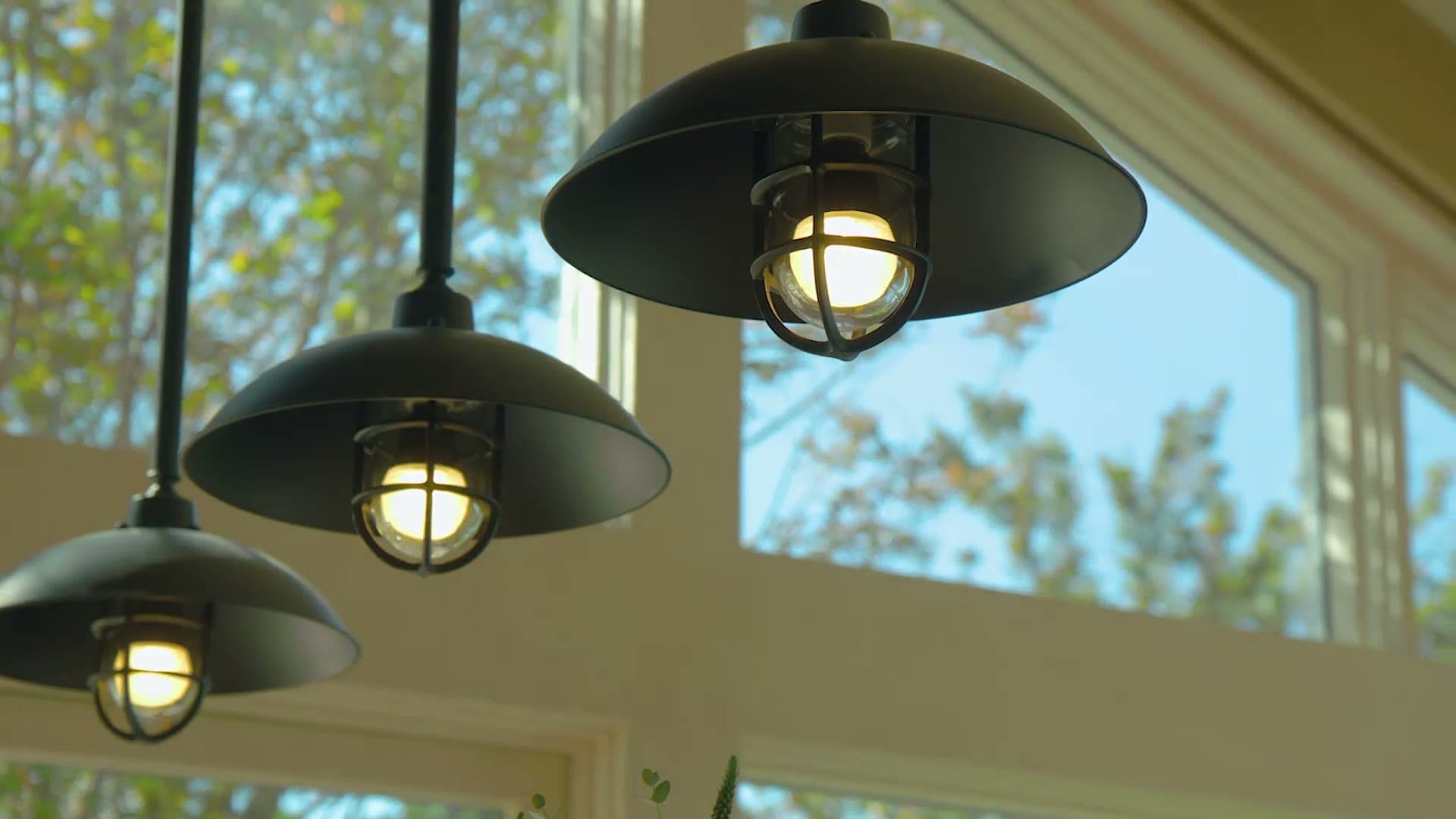 Smart pendant lights glowing in a bright modern kitchen