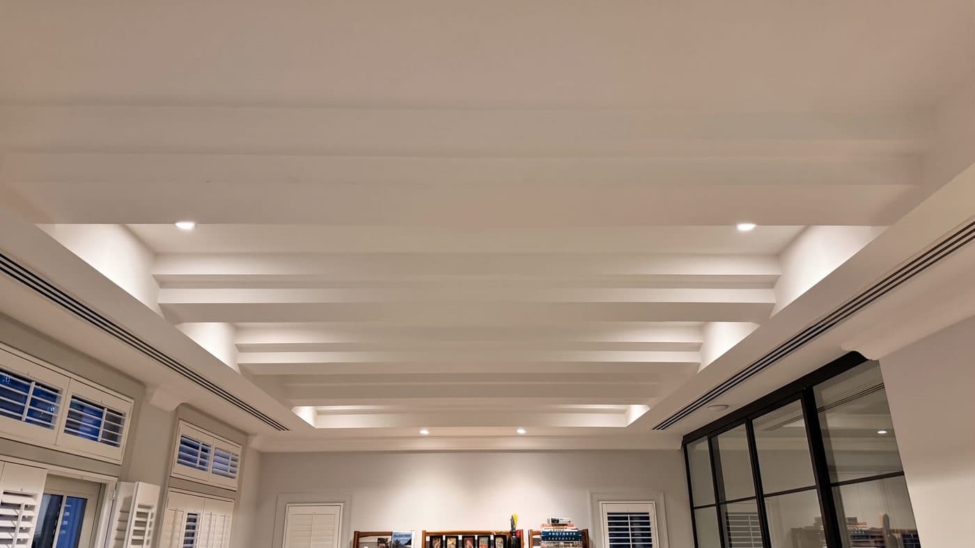 Coffered ceiling in a Jumeirah Golf Estates villa lit by recessed smart downlights in the evening