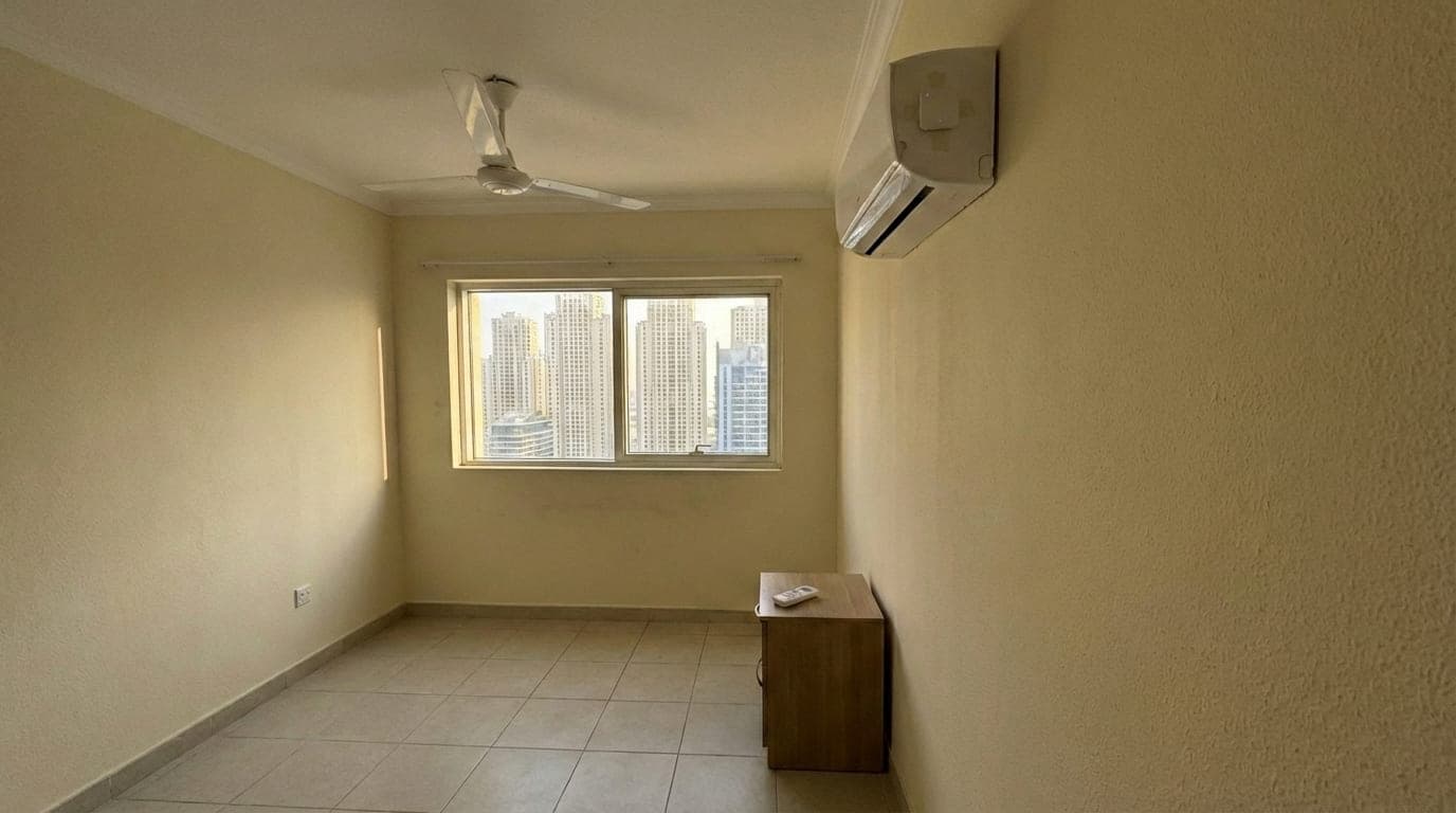 Smart AC controller installed on split unit in Dubai Marina studio apartment